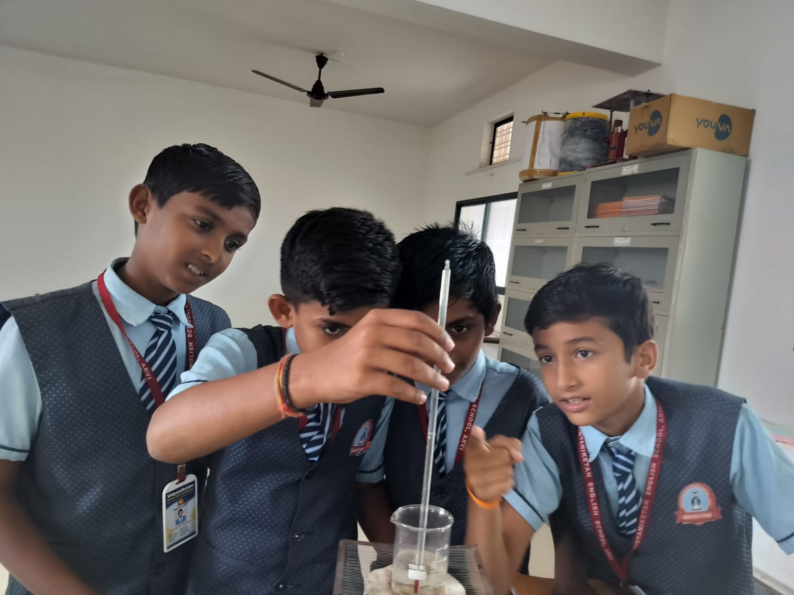 Students Performing Experiment